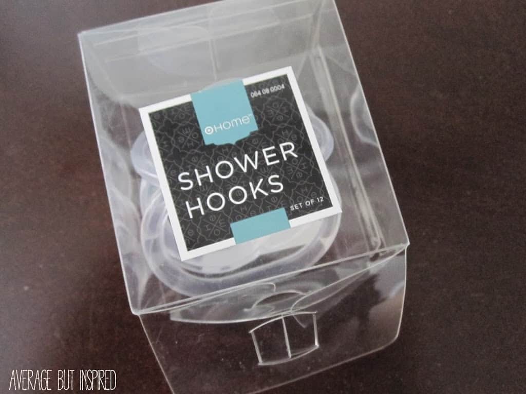 Use shower hooks to create a DIY scarf organizer.