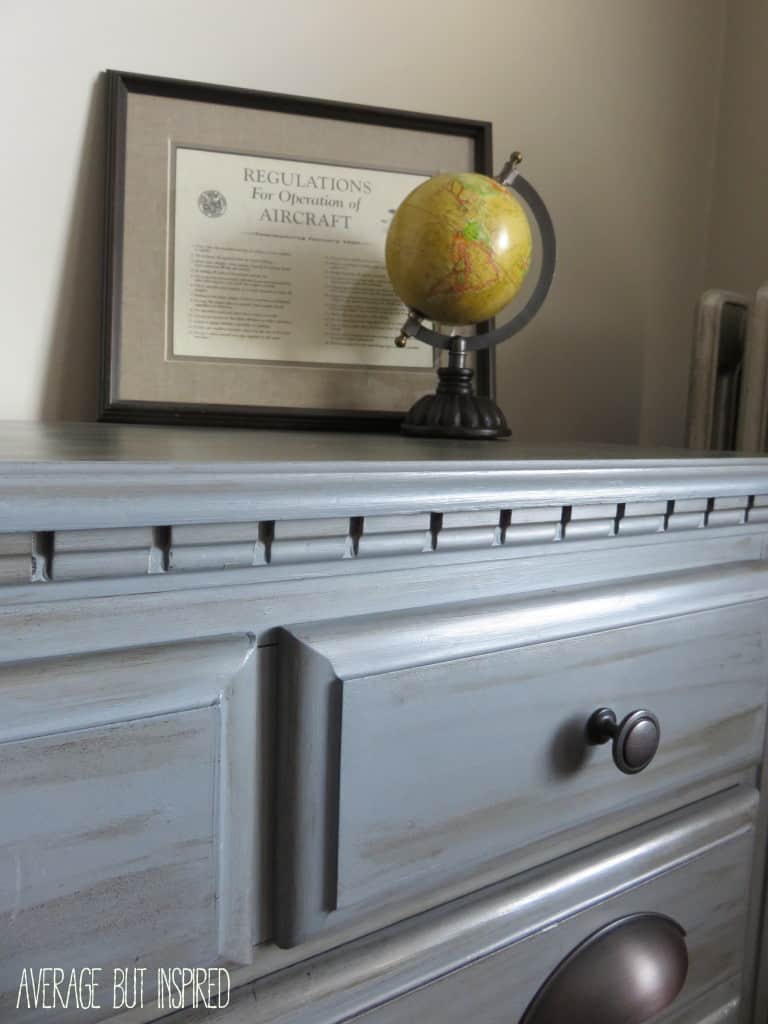 This gray chalk paint dresser makeover is so pretty! She mixed Americana Decor Chalky Finish paint in Yesteryear and Relic to create a custom gray chalk paint.