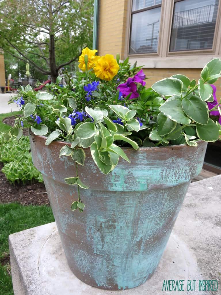 DIY Faux Copper Planters give the look of aged copper at a fraction of the price! Copper patina paint gives this realistic look. 