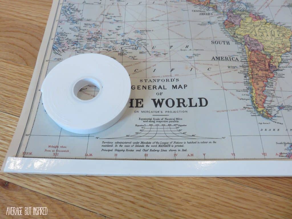 Map wrapping paper is transformed into easy DIY map art with a few simple supplies! Full tutorial on how to make your own for under $10!