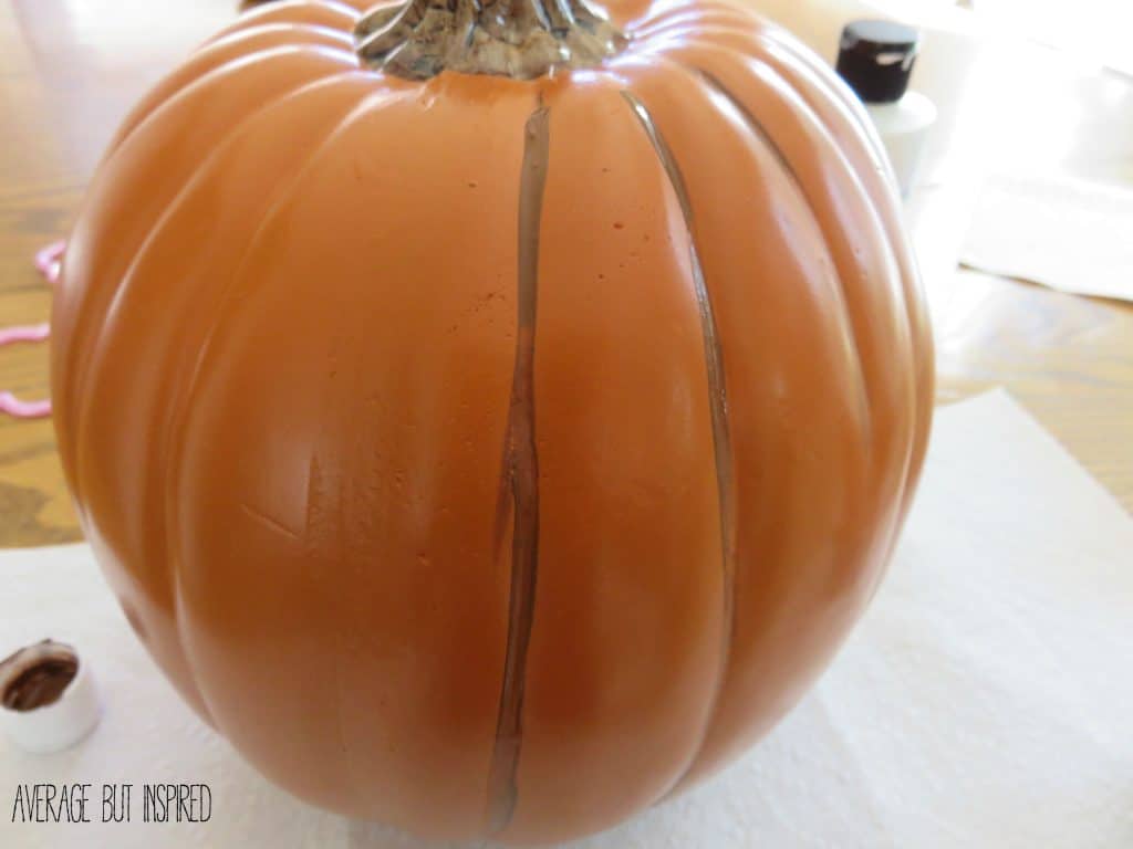 Love this! Make fake pumpkins look real with a little bit of paint! Use them year after year and keep the squirrels away!