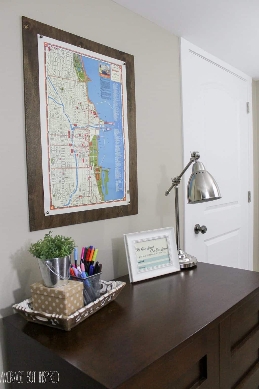 Give your large scale art a pretty "frame" with this easy DIY plywood poster frame project! You don't even have to cut the wood yourself! Find out all the details on how to "frame" your art in under 10 minutes!