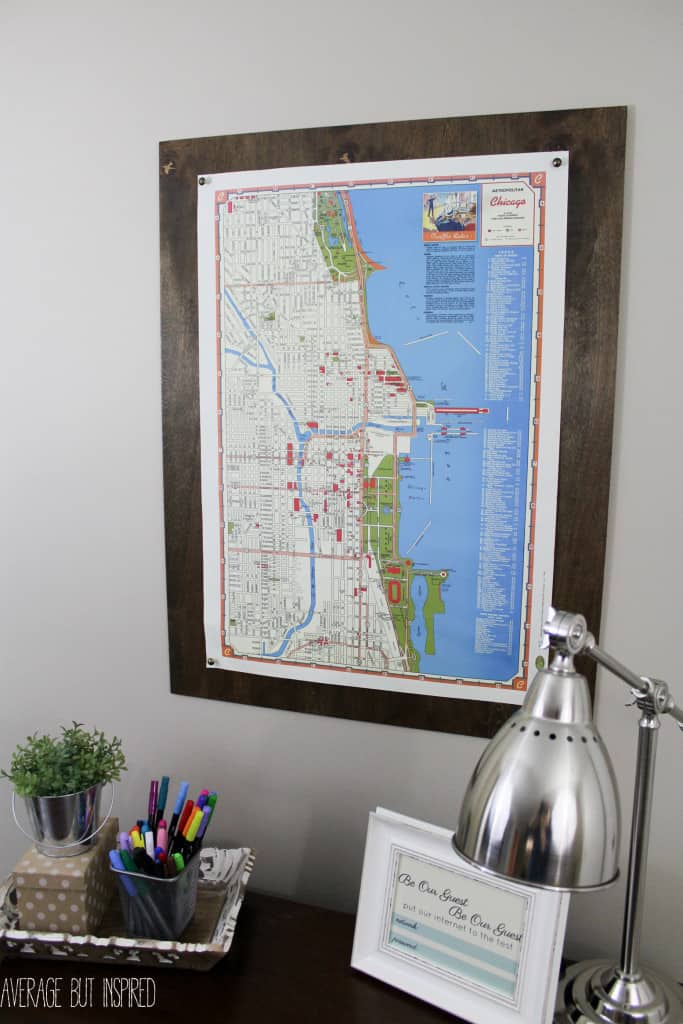 Give your large scale art a pretty "frame" with this easy DIY plywood poster frame project! You don't even have to cut the wood yourself! Find out all the details on how to "frame" your art in under 10 minutes!