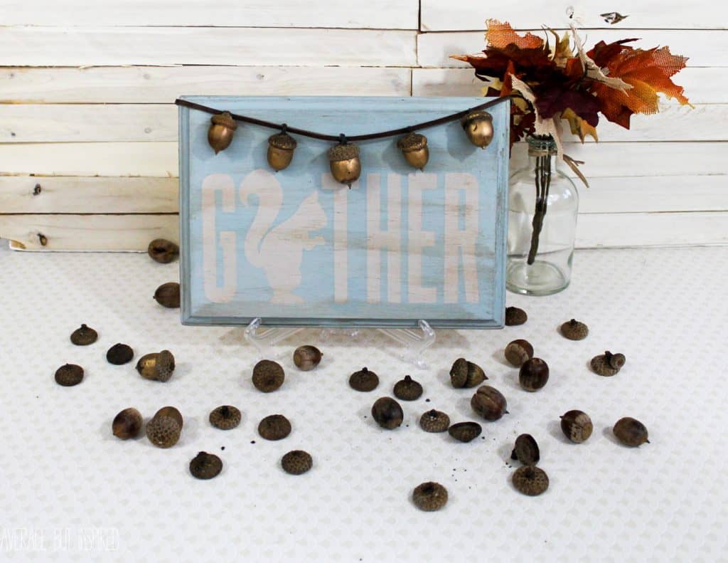 Golden acorns add a fun touch to a cheeky decorative sign for fall. Get the full tutorial on how to make one right here!