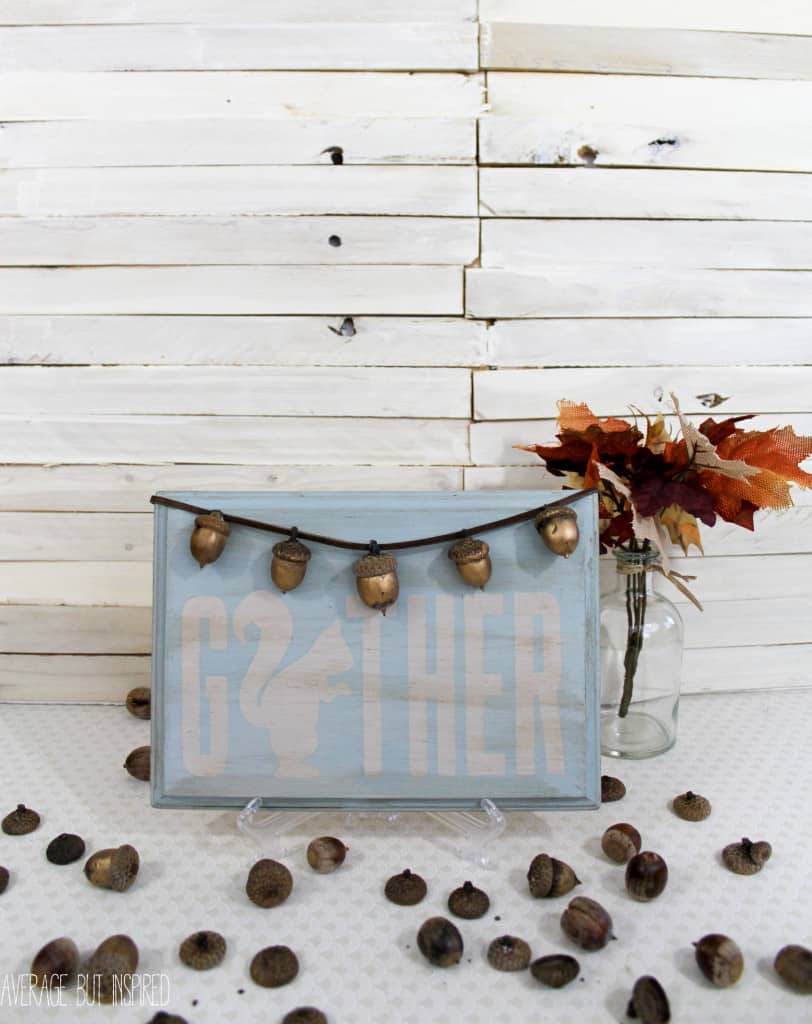 This acorn craft is adorable! Use acorns to make a cute fall sign. This is an easy acorn craft for adults.