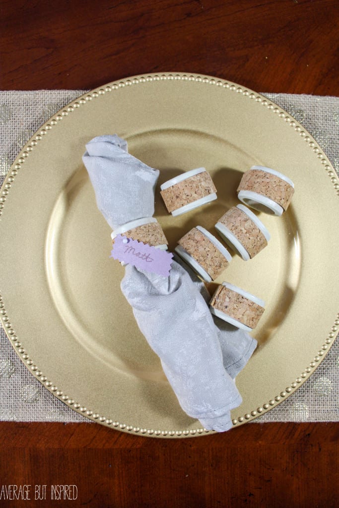 DIY cork napkin ring place cards pull double duty by keeping napkins in place and telling guests where to sit! Learn how to make them with this quick and easy tutorial.