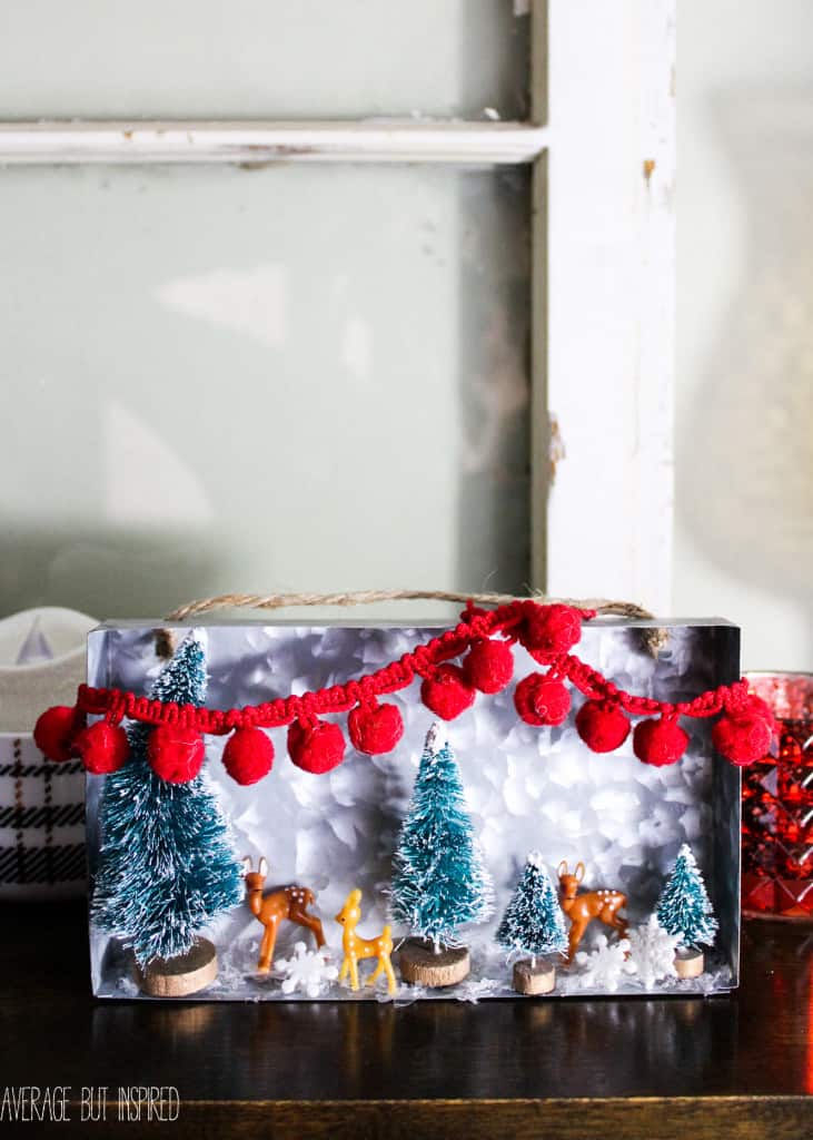 Bottle brush trees and mini plastic deer help make an adorable diorama for Christmas!