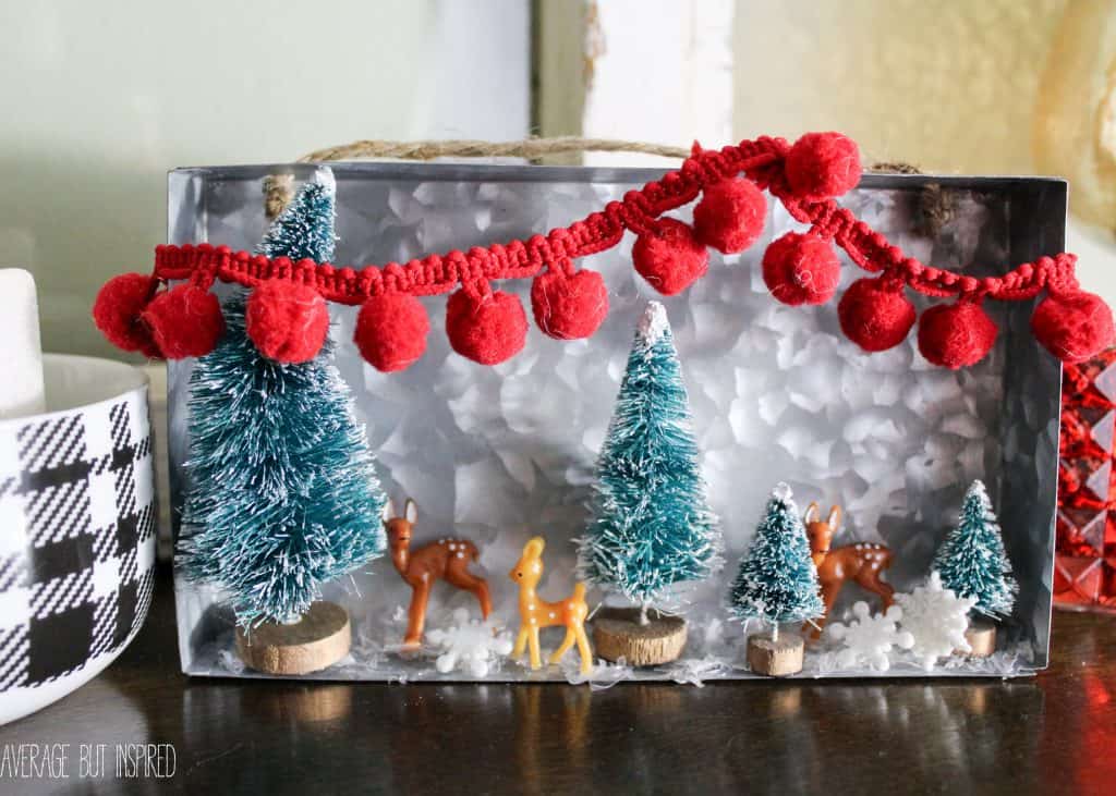 Bottle brush trees and mini plastic deer help make an adorable diorama for Christmas!