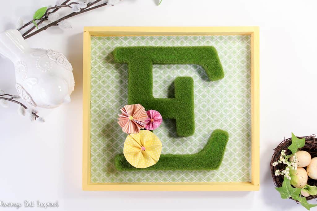 A moss monogram shadow box is a perfect way to welcome spring to your home! Click through to get the full supply list and tutorial to make your own!