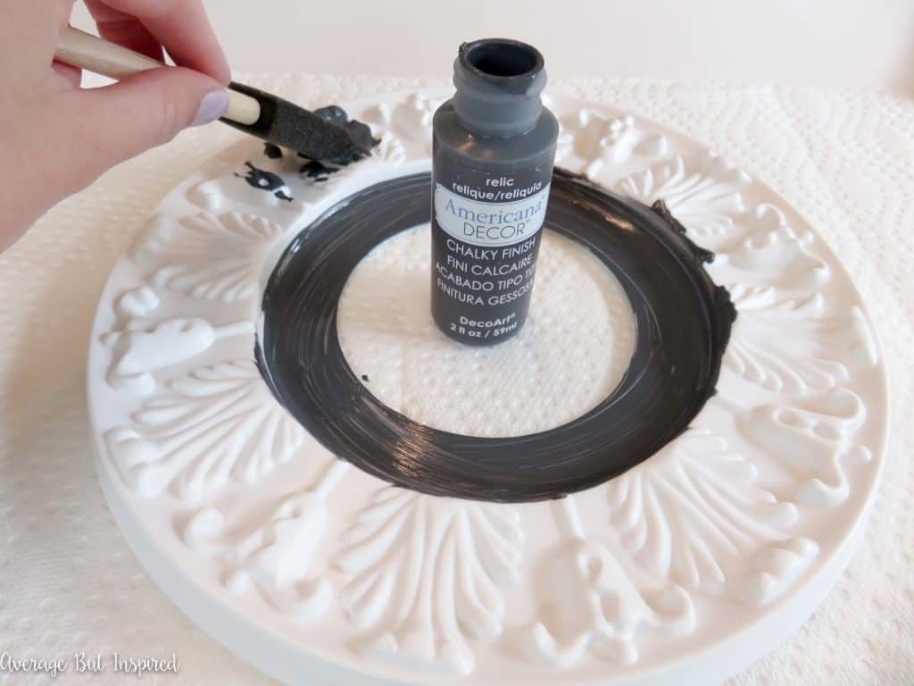 Add a decorative touch to any space with a pretty ceiling medallion mirror that you can make with just a few basic supplies!
