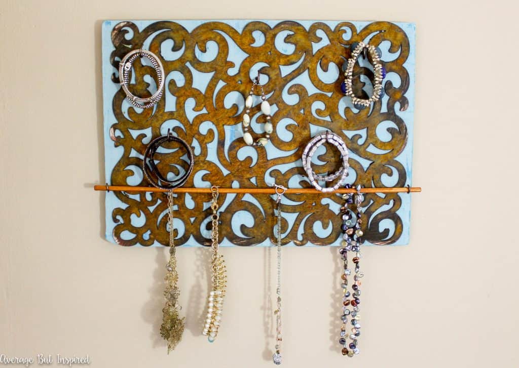 So pretty! Make your own DIY jewelry holder and learn how to give it a faux rust finish with this great tutorial!