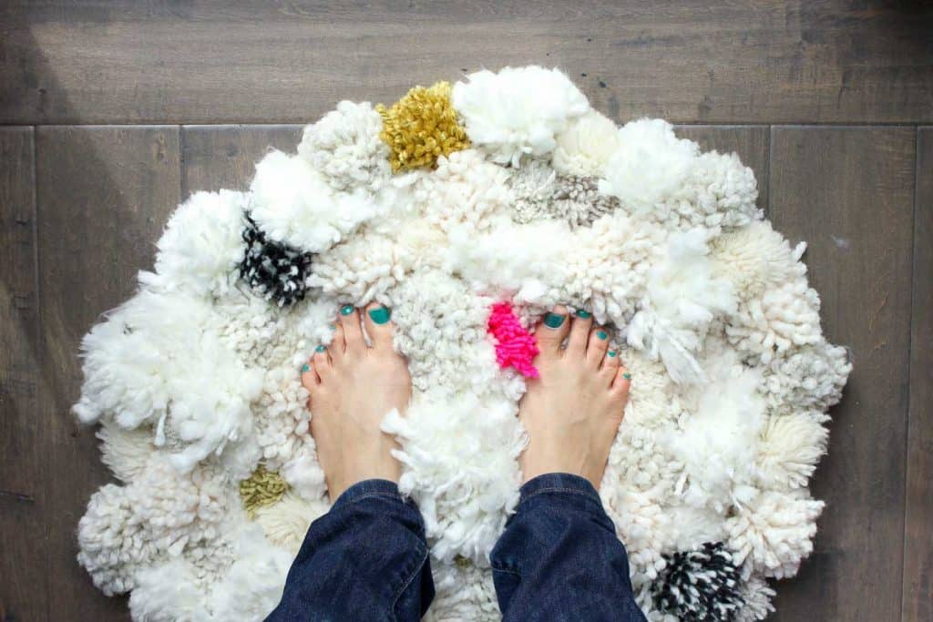 Learn how to make a pom pom rug with this tutorial from Make and Do Crew!