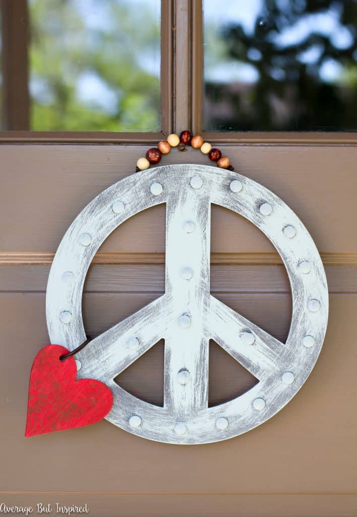 A DIY Peace Sign Wreath is a great way to greet visitors to your home! Get the full tutorial in this post.