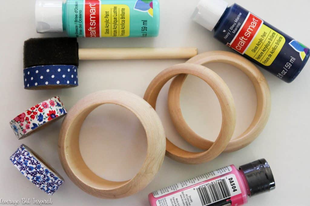 Customize plain wooden bangles with paint and fabric tape for a quick and easy DIY bracelet! Get the full supply list and tutorial in this post.