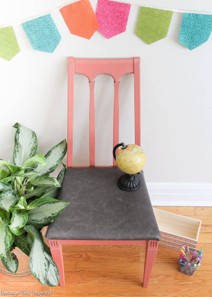 An ugly old chair gets new life with gorgeous paint and a reupholstered leather seat.