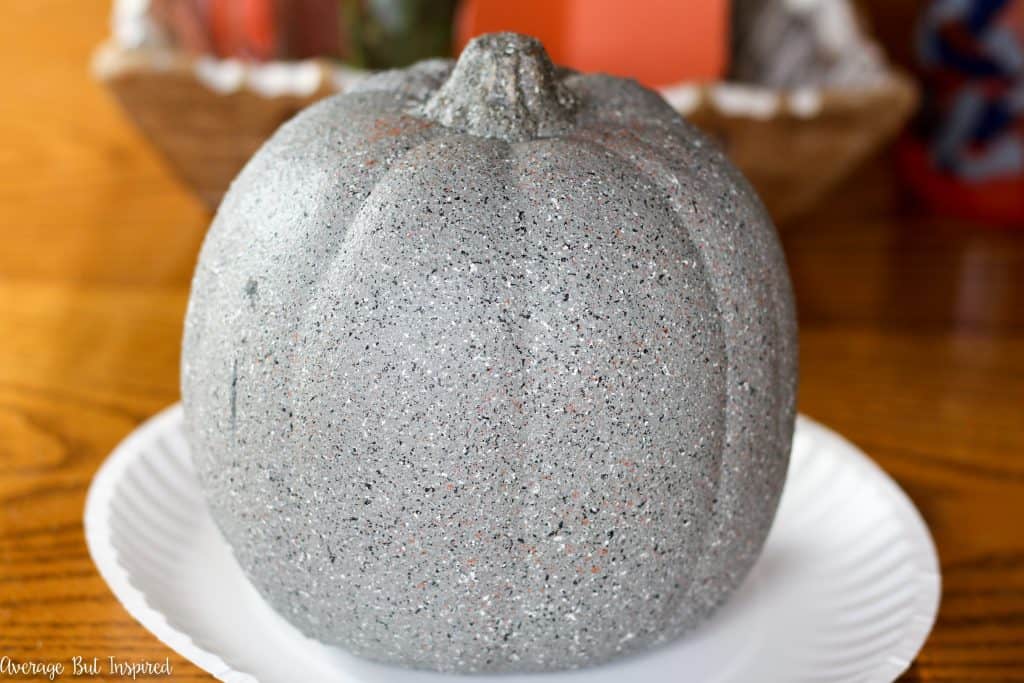 Faux concrete pumpkins are easy to make and a perfect pumpkin for your porch! Get the tutorial on how to make concrete look pumpkins in this post.
