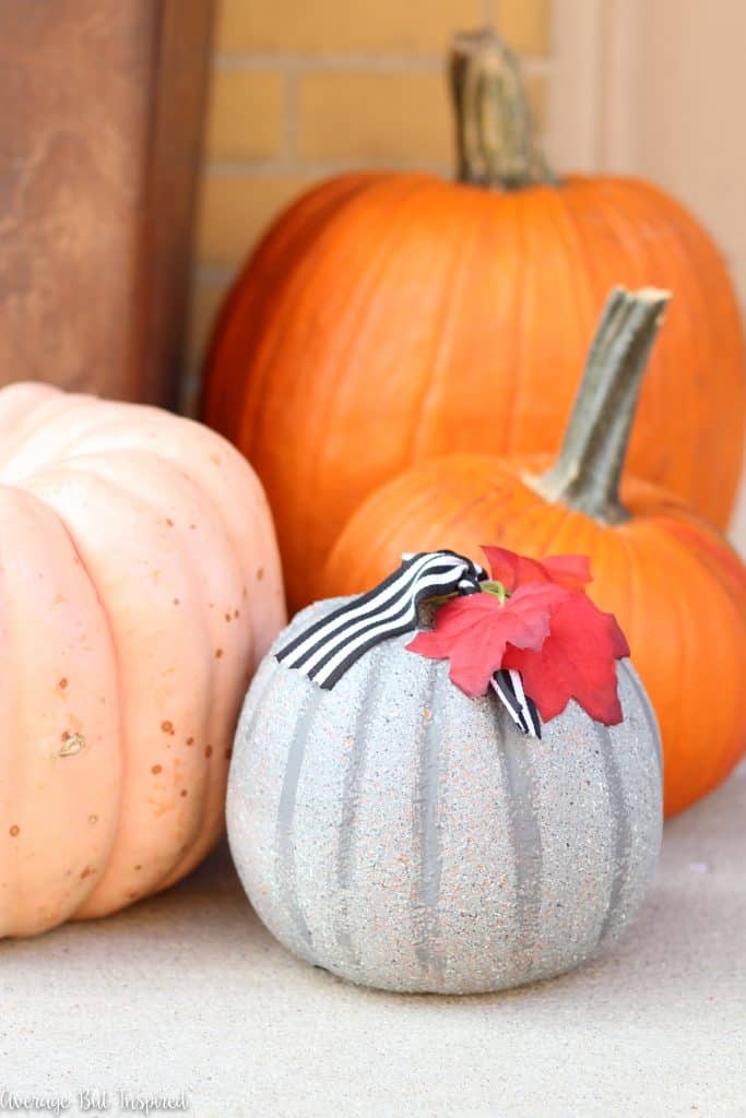 Faux concrete pumpkins are easy to make and a perfect pumpkin for your porch! Get the tutorial on how to make concrete look pumpkins in this post.