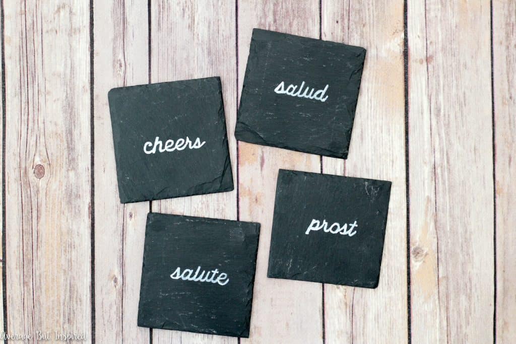 In just ten minutes you can make these DIY coasters! Learn how to customize slate coasters with ANY saying or image you want! These diy coasters are a perfect handmade gift for anyone on your list.