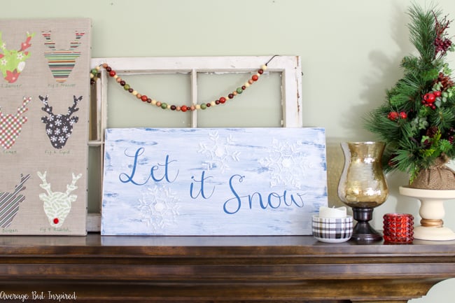 It only takes one piece of wood to make two adorable painted wood signs! Learn how to make a DIY reversible Christmas to winter sign with this tutorial.