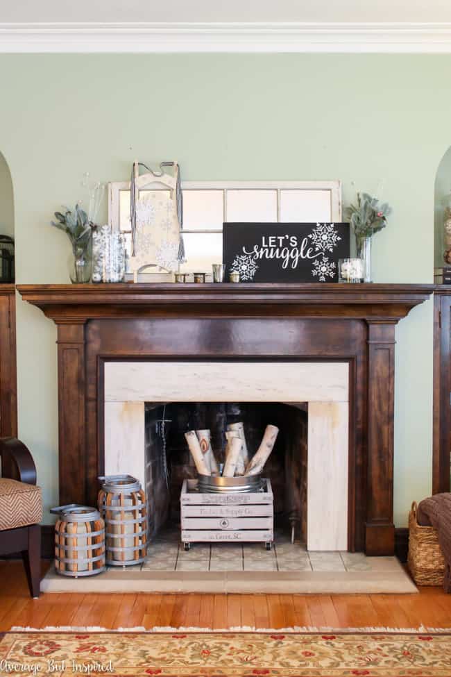 Such a great idea to create a pretty winter mantel after Christmas! This post shows you how to use items you may already have to decorate your mantel for winter.