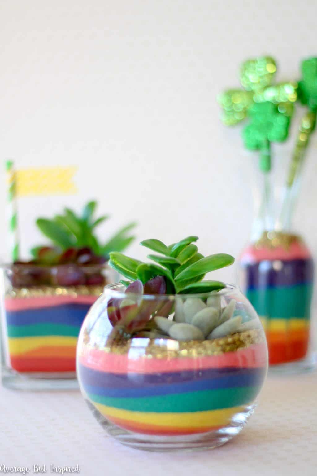 These Rainbow Sand Art Terrariums are sure to put a smile on anyone's face! Add a lot of color to glass vases with colored sand in rainbow hues! A perfect St. Patrick's Day craft for any age!