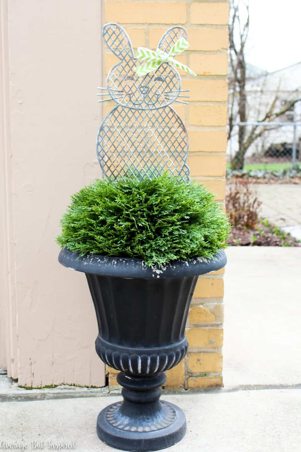 Give plastic dollar store planter stakes a beautiful makeover with a faux metal finish! Learn how to easily upgrade the look of these cute spring decorations in this post.