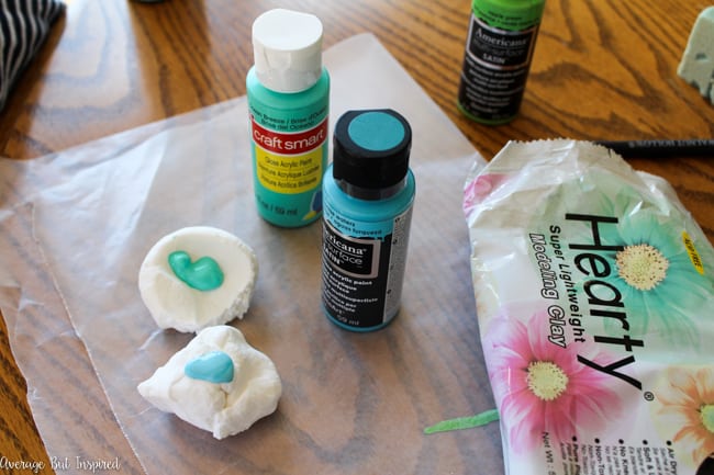 Use lightweight air dry clay to create adorable DIY air dry clay garden markers. Use paint to achieve a marbled air dry clay look and add some spunk to your garden or flower pots this season!