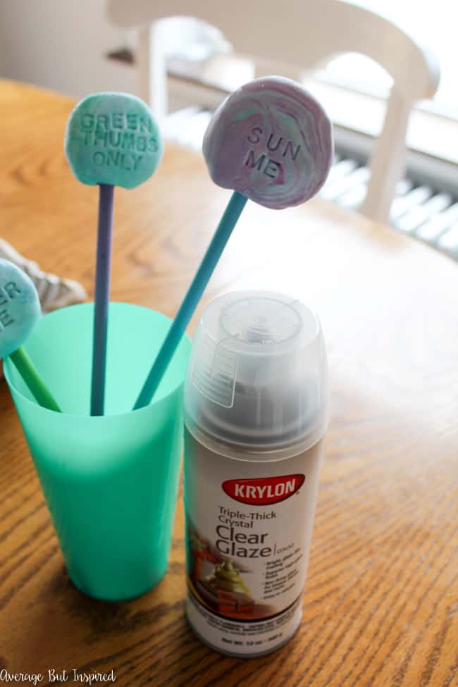 Use lightweight air dry clay to create adorable DIY air dry clay garden markers. Use paint to achieve a marbled air dry clay look and add some spunk to your garden or flower pots this season!