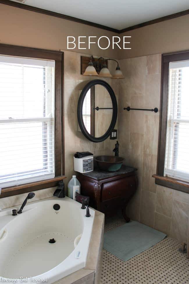 This dark and dated bathroom got a makeover with mold resistant paint. This is the before photo.