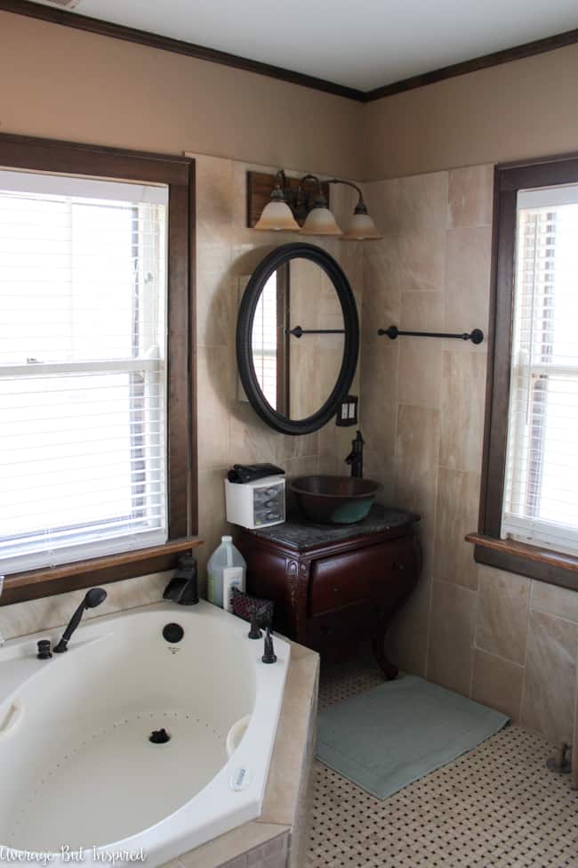 An outdated master bathroom that's practically falling apart will get a big update during the One Room Challenge! This "before" photo will look so different at the end of the challenge!
