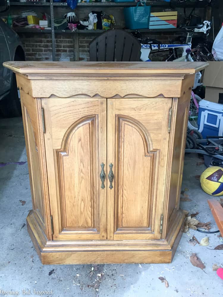 This dated console cabinet was given a stunning makeover with FAT Paint chalky style paint in Antique Wedgewood and white wax. Click through to see the before and after photos!