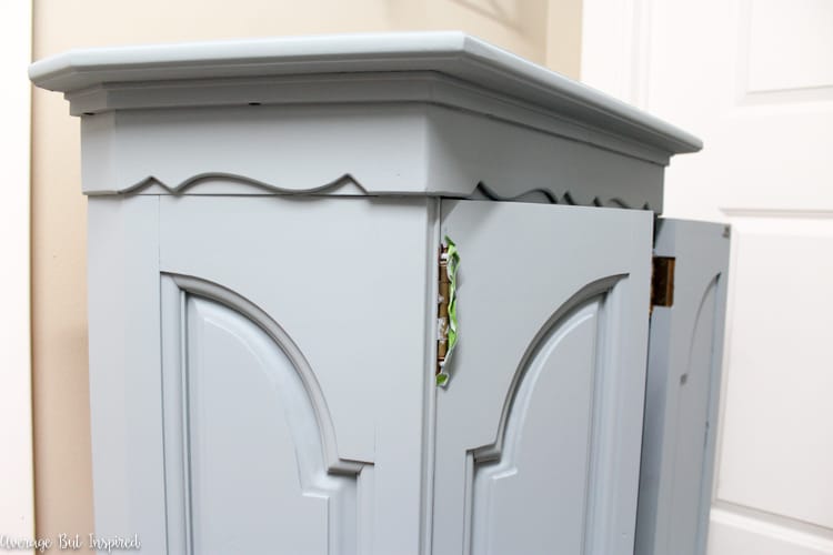 This dated console cabinet was given a stunning makeover with FAT Paint chalky style paint in Antique Wedgewood and white wax. Click through to see the before and after photos!