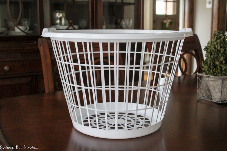 It's easy to transform a dollar store laundry basket into a pretty burlap basket! What a great Dollar Tree craft project!