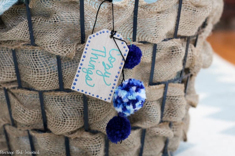 It's easy to transform a dollar store laundry basket into a pretty burlap basket! What a great Dollar Tree craft project!