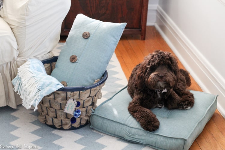 It's easy to transform a dollar store laundry basket into a pretty burlap basket! What a great burlap craft idea!