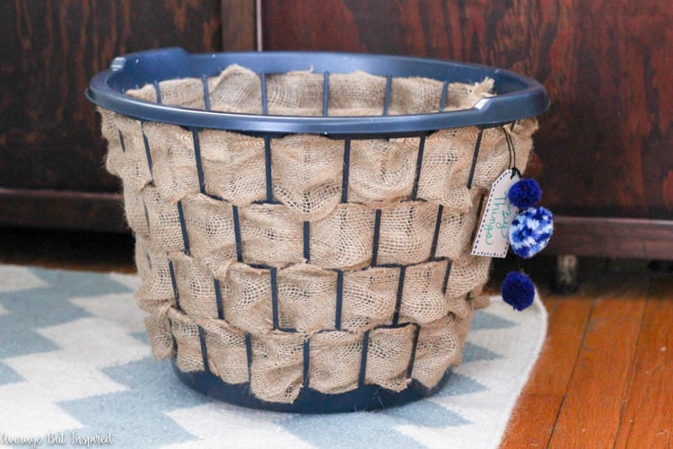 It's easy to transform a dollar store laundry basket into a pretty burlap basket! What a great Dollar Tree craft project!