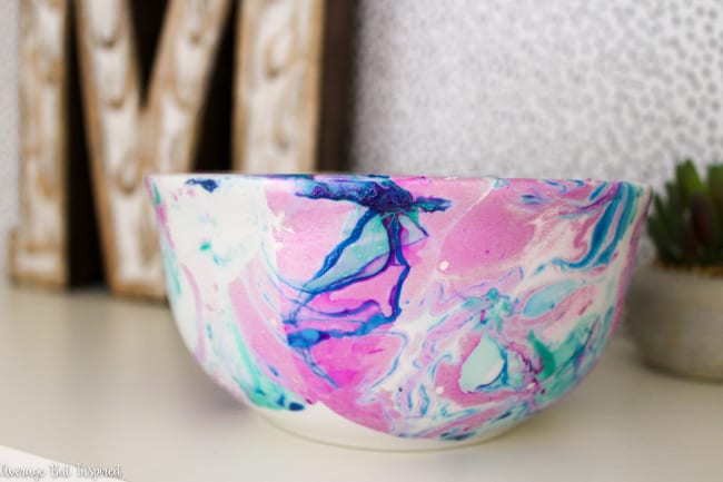 Learn how to make just about any plain object beautiful with nail polish marbling! This post has a video that shows you how to marble with nail polish. It is such a fun technique!