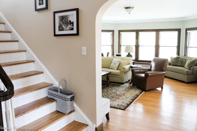 A dated staircase basket from the thrift store got a fresh new look with spray paint, ribbon, and a chalkboard tag.