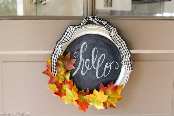 Transform a silver tray into a wreath! Learn how to make a Dollar Tree silver tray sparkle as a beautiful fall wreath in this post.