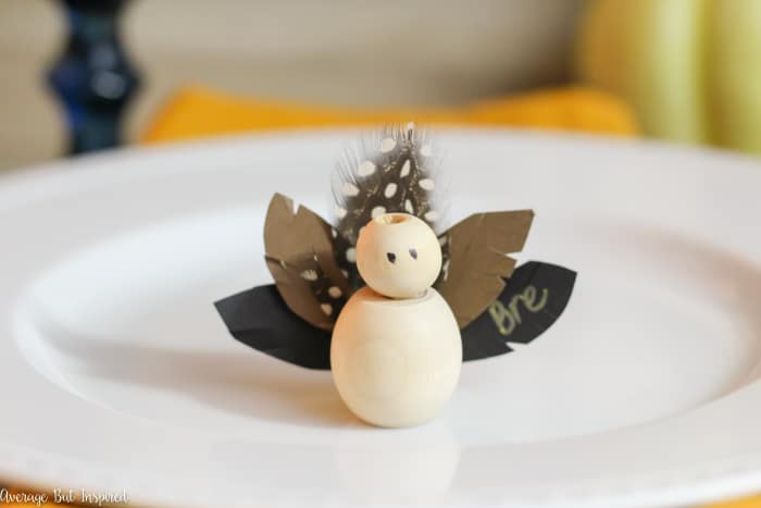 Make adorable Thanksgiving Turkey Place Cards with wooden beads for your Thanksgiving table this year! Learn how to make these DIY Thanksgiving place cards with this easy tutorial! #Thanksgiving #placecards #ThanksgivingTable