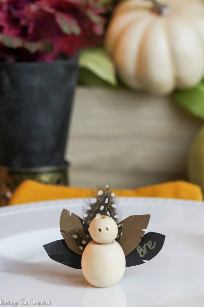 Make adorable Thanksgiving Turkey Place Cards with wooden beads for your Thanksgiving table this year! Learn how to make these DIY Thanksgiving place cards with this easy tutorial! #Thanksgiving #placecards #ThanksgivingTable