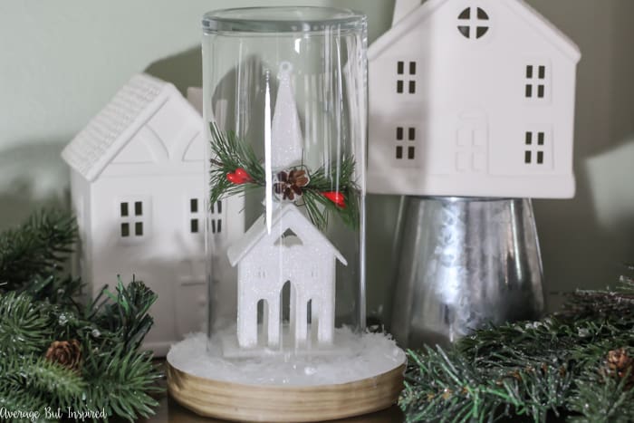 Transform a dollar store ornament and other supplies into a pretty Christmas Cloche for your DIY Christmas decor! #dollarstore #dollartree #Christmasdecor