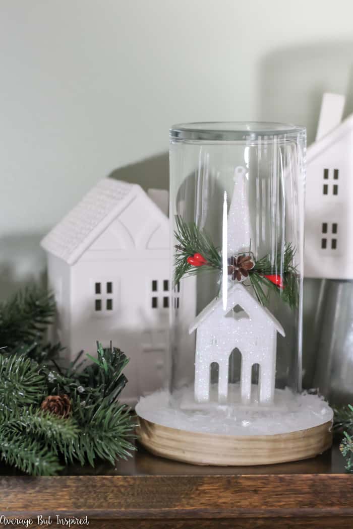 Transform a dollar store ornament and other supplies into a pretty Christmas Cloche for your DIY Christmas decor! #dollarstore #dollartree #Christmasdecor