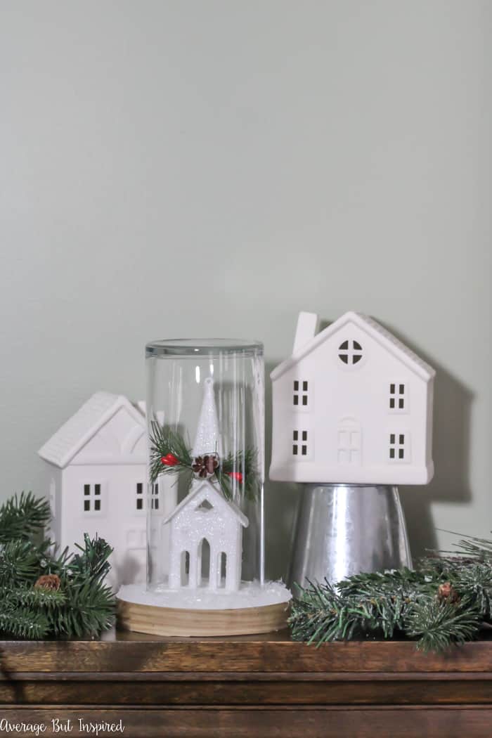 Transform a dollar store ornament and other supplies into a pretty Christmas Cloche for your DIY Christmas decor! #dollarstore #dollartree #Christmasdecor