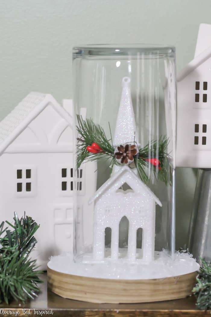 Transform a dollar store ornament and other supplies into a pretty Christmas Cloche for your DIY Christmas decor! #dollarstore #dollartree #Christmasdecor