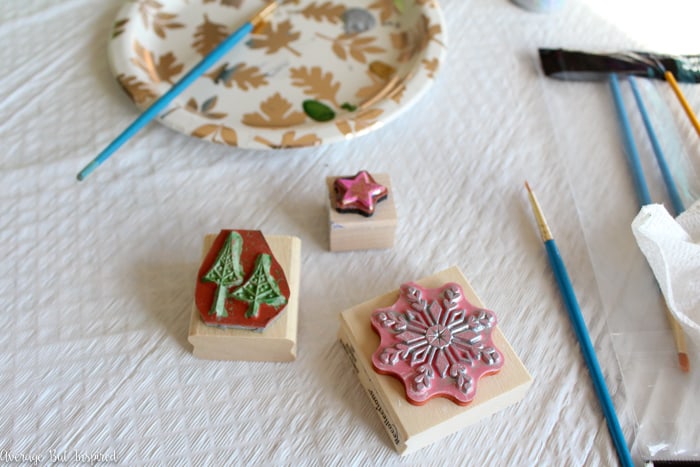 Tile samples can be turned into beautiful ornaments with this tutorial! These upcycled tile Christmas ornaments are so easy to make and fun for all ages! #upcycle #ChristmasCrafts #ChristmasOrnaments