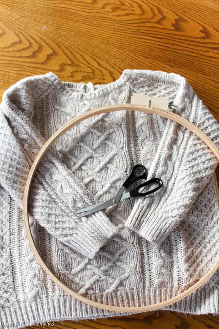 Upcycled sweater embroidery hoop art is a great way to use less-than-perfect sweaters in home decor! Instead of throwing your sweaters away, turn them into art for your home! #embroideryhoop #upcycle #upcycledsweater