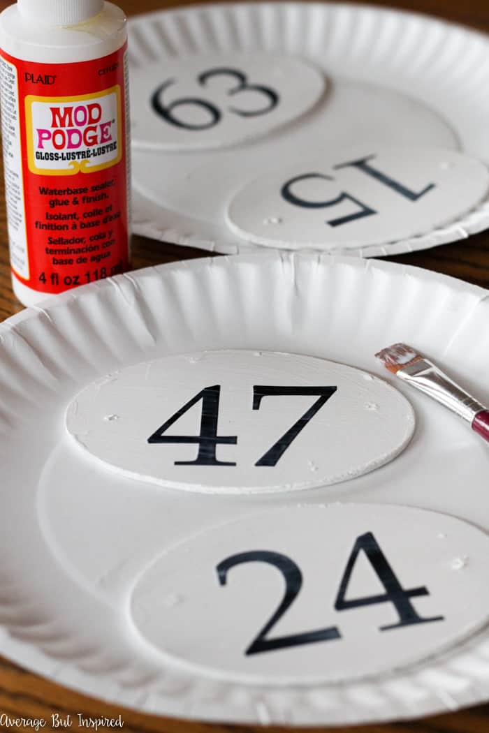 It's so easy to make faux French enamel number tags with inexpensive craft supplies like paint! Learn how to make these French enamel number tags for your home decor and organization projects.