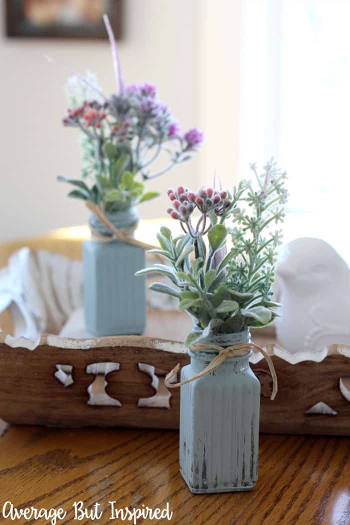 {Video Tutorial!} Transform dollar store salt and pepper shakers into adorable bud vases! This tutorial shows you how to make this dollar store craft in no time! Plus, it's very affordable. Great for cheap baby shower or wedding shower decor, or home decor! #dollarstorecrafts #upcycle