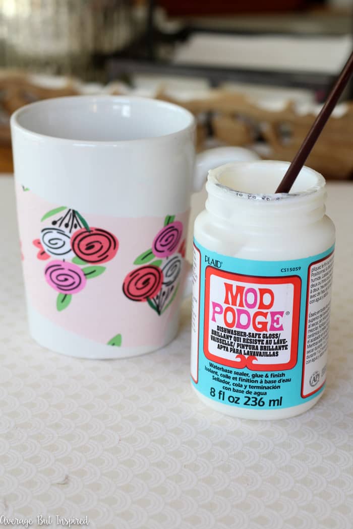 Learn how to make a bold and dishwasher safe DIY Tissue Paper Mug with this easy project tutorial! With just four supplies you can make these adorable DIY coffee mugs that are perfect for inexpensive gifts or girls night craft parties! Anyone can make tissue paper mugs! 